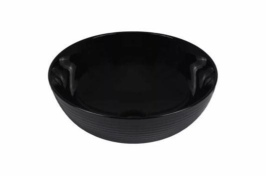 Ronde zwarte keramische waskom met glanzende afwerking en subtiele ribbelstructuur, perfect voor een moderne en luxe badkamerstijl